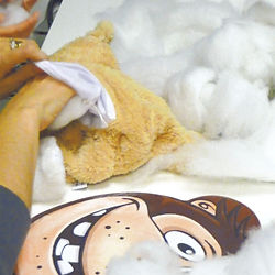 a customer stuffing a bear at Crafty Monkey's Build a Bear