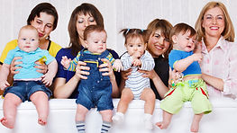 Group of mums creating baby print pottery