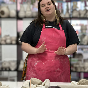 A Crafty Monkey Pottery Class instructor teaching hand building techniques