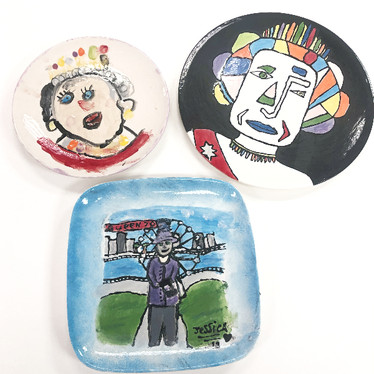 Three of the winning plates from the Jubilee Pottery Painting competition run by St. Neots Town Council.