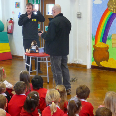 Mark Hansard and Gary Lee from Black Cat Radio at a St. Neots primary school promoting the mug painting competition ran in conjunction with Crafty Monkey