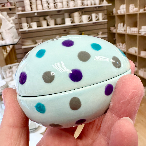 Egg pot painted at Crafty Monkey with pale blue background and different colour dots