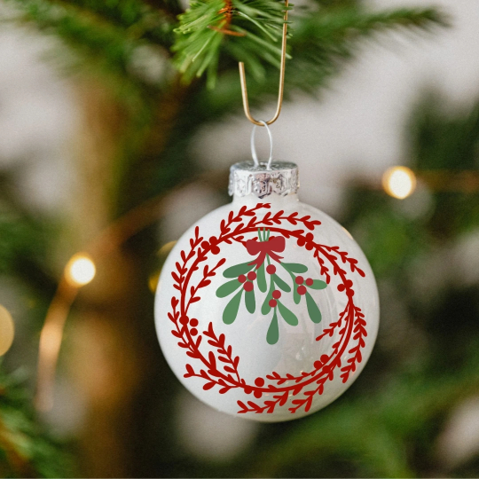 Bauble with a red wreath design and mistletoe in the middle.