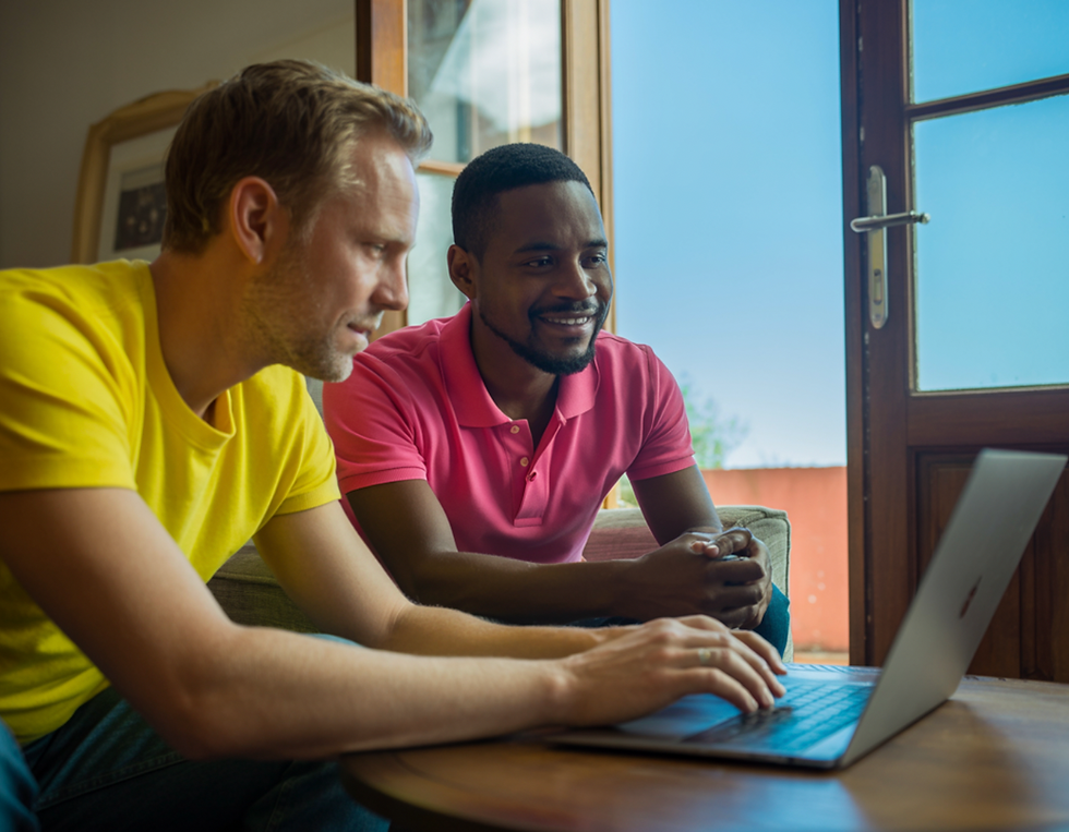 Gay couple using a laptop