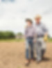farmer-and-teenage-grandson-walking-over-ploughed-2024-12-13-02-48-27-utc.jpg