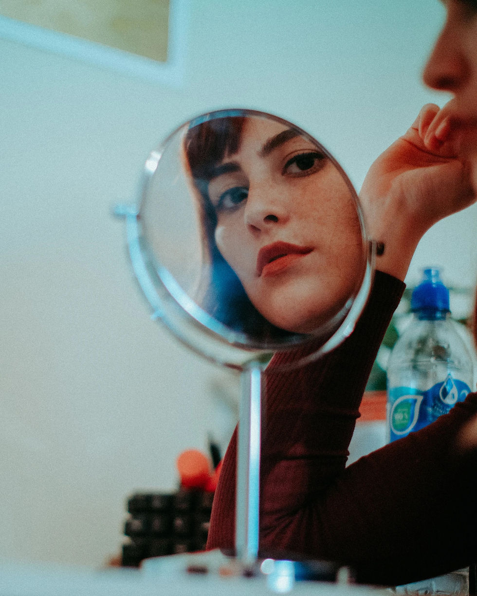 Woman looking in the mirrror
