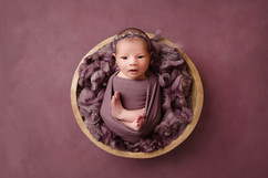 beautiful baby girl in purple