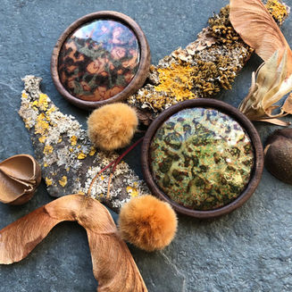 Enamel on copper brooches with patterns inspired by nature, mosses and lichens