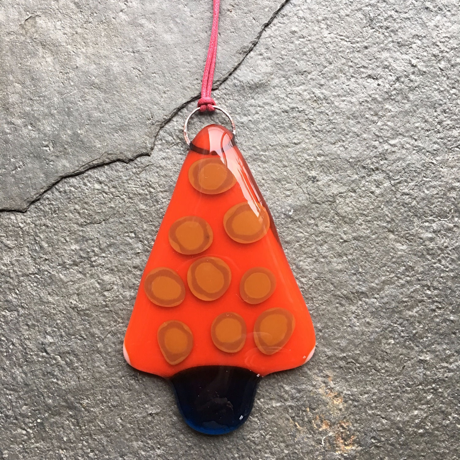 Orange and caramel spotted fused glass Christmas tree decoration by Eleanor J Watson at Rainbow Glass Studios