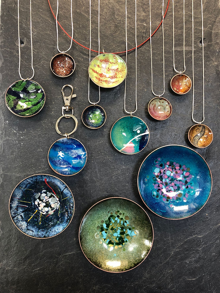 The collection of enamelled and domed forms and copper bowls made by students in May 2025 on our day course