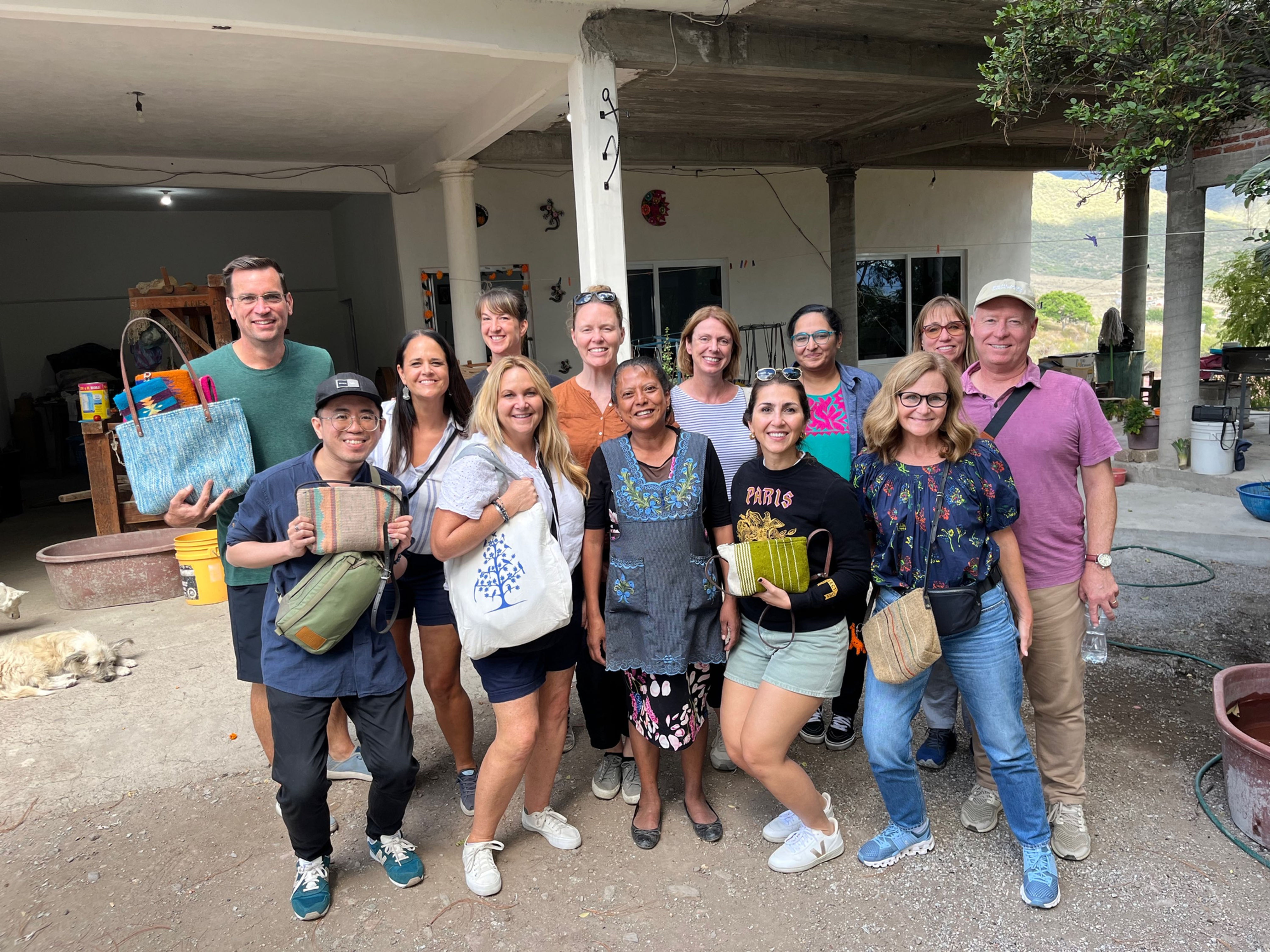 Fundacion En Via Microfinance tour group participants with artisans