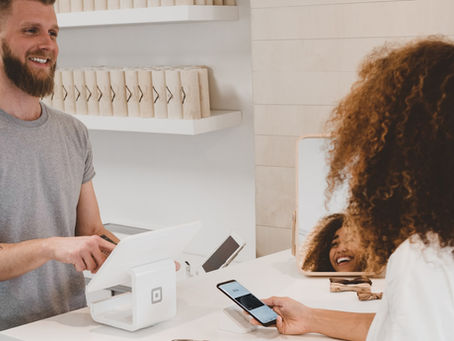 Local business owner welcoming customers through TripTips referral network