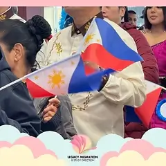 Filipino community event featuring attendees holding Philippine flags during a cultural celebration and gathering.