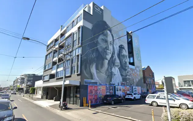 AIIT Campus Brunswick East building with modern architecture and large exterior mural