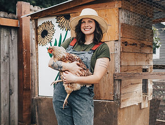 Drake holding one of her chickens