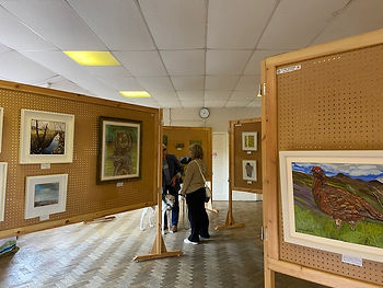 Visitors looking at artwork