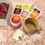 Thumbnail: Front view of gift set option - burnt orange mug, herbal tea blend, reusable teabags  & tea samples