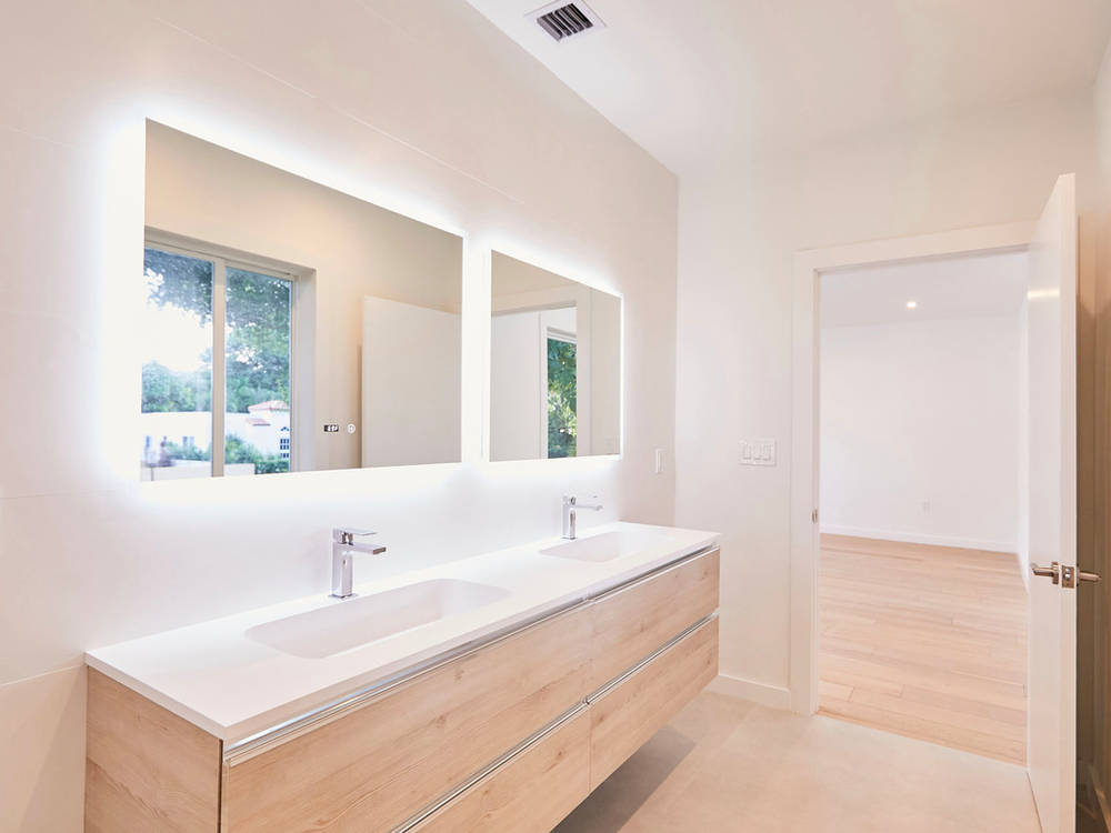 Goldstucker Residence — bathroom with lit mirrors