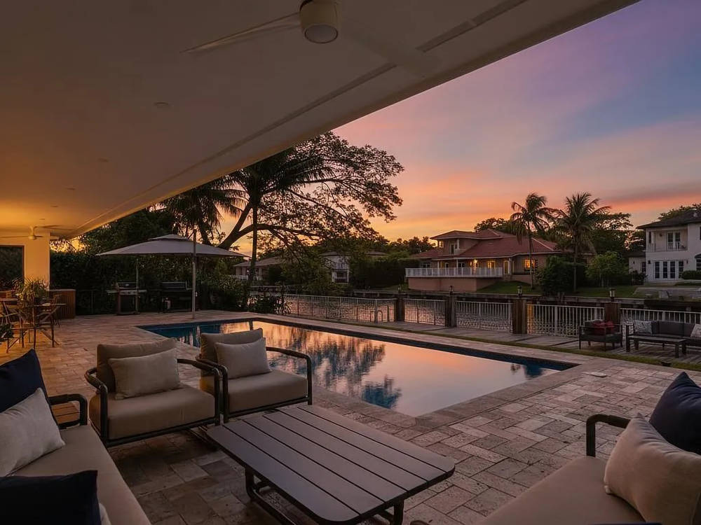 Lugo Residence — covered terrace and pool at dusk