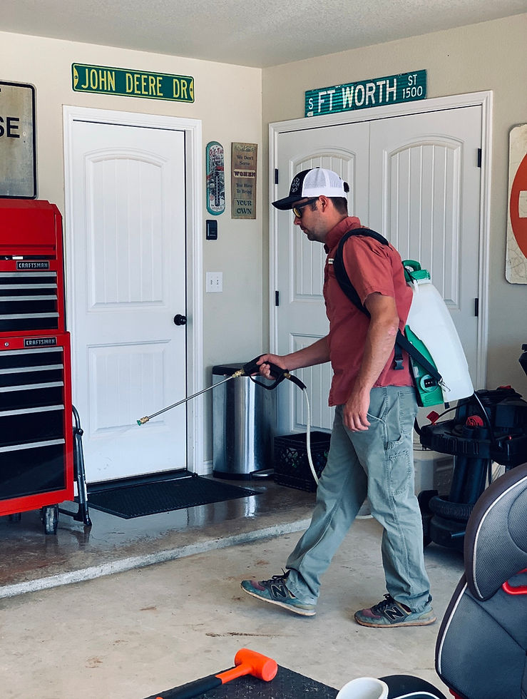 Tejas Pest and Weed Control technician treating the floor line inside a residential garage in the Permian Basin. Fall spider control for Midland and Odessa, Texas.