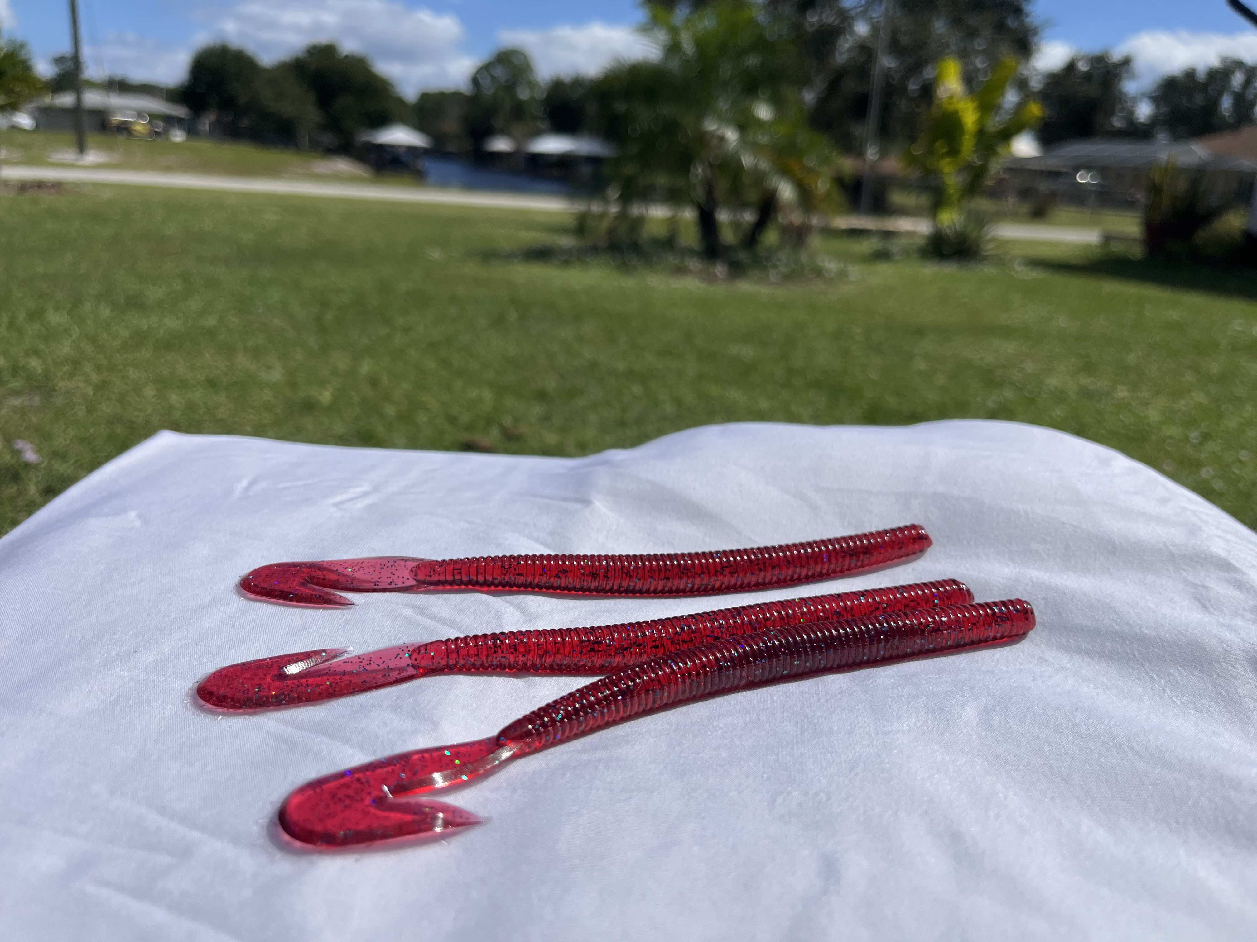 Top selling soft plastic bass fishing lures from Cliff Bait laid out for selection