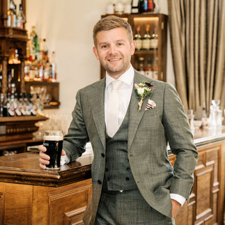 Waterford castle groom with a pint of Guinness 
