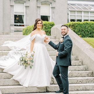 Faithlegg House Hotel wedding Bride and groom on the stairs in rose garden 
