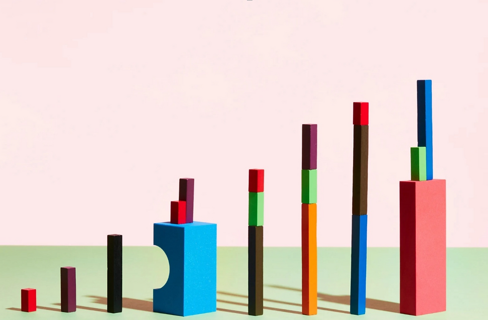 Colorful stacked building blocks arranged in increasing height, symbolizing growth and solid foundations to build a business that lasts.