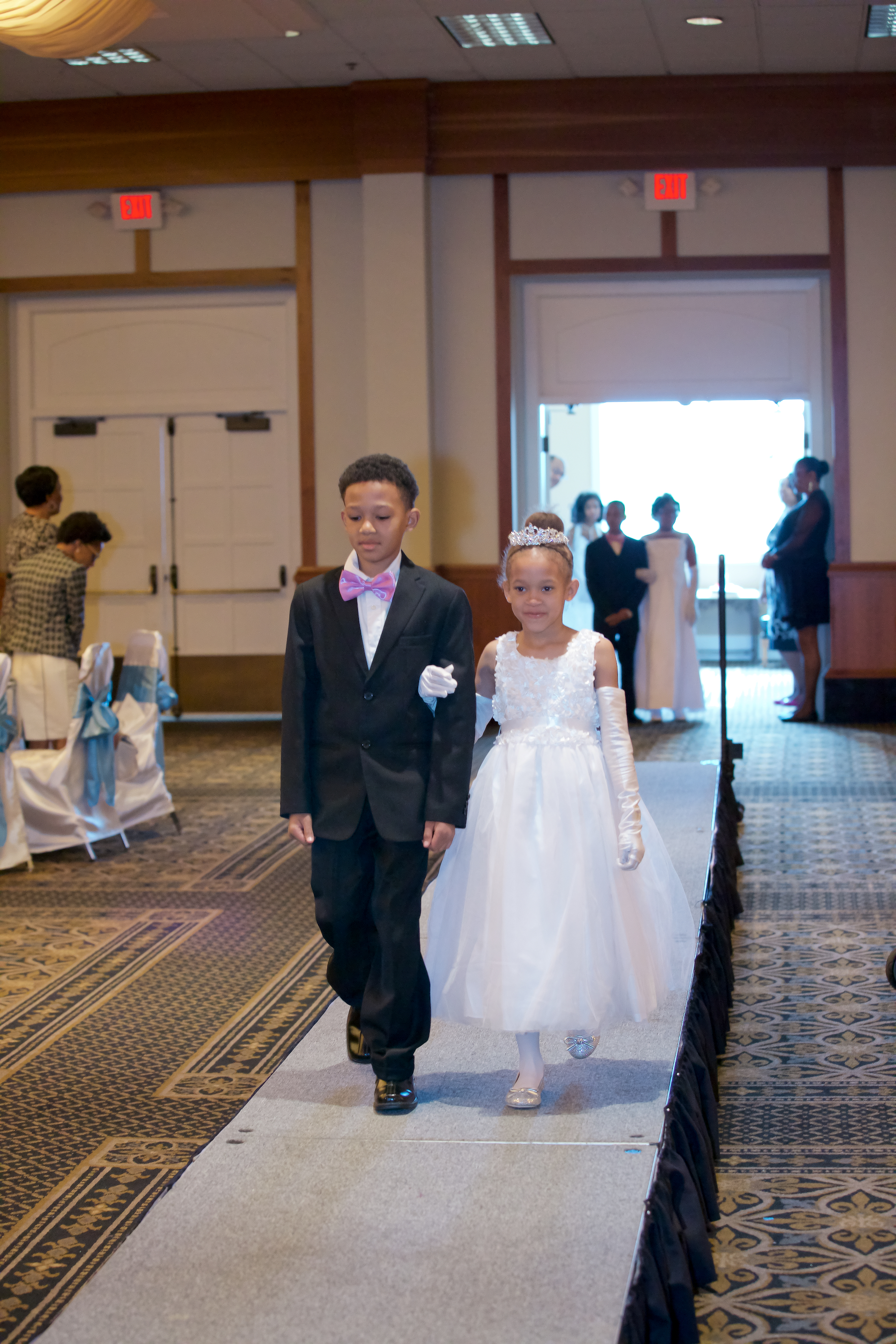 Neaveha escorted by her big brother
