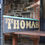 Thumbnail: Antique Original Salvaged THOMAS Hand Carved Gilt Painted Wooden Shop Front Sign