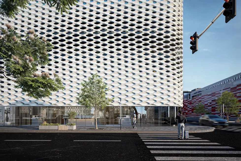 Flux Parking – Sustainable parking structure with parametric aluminum cladding at dusk