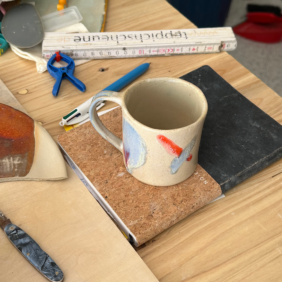 Thumbnail: Beige cup with blue and red