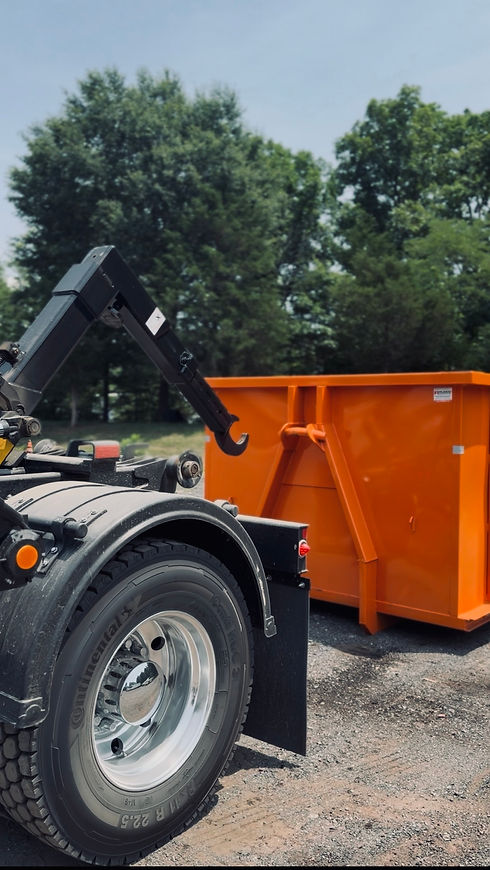 hook-lift-dumpster-loading-rock-solid-disposal.jpg