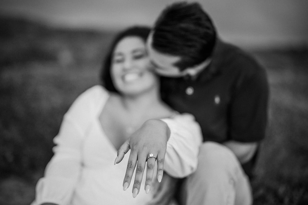 couple show of engagement ring