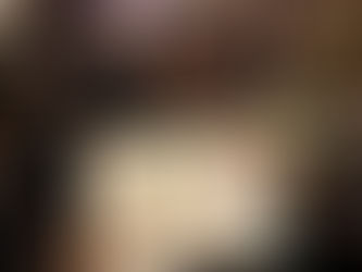 Leila smiling proudly, holding a 2026 vision board with motivational words and pictures