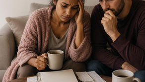 Couple doing their finances looking worried