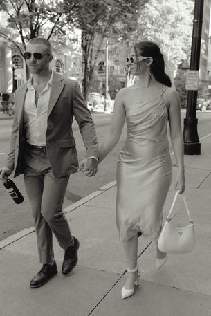 stylish couple outside fox theatre engagement photography in black and white