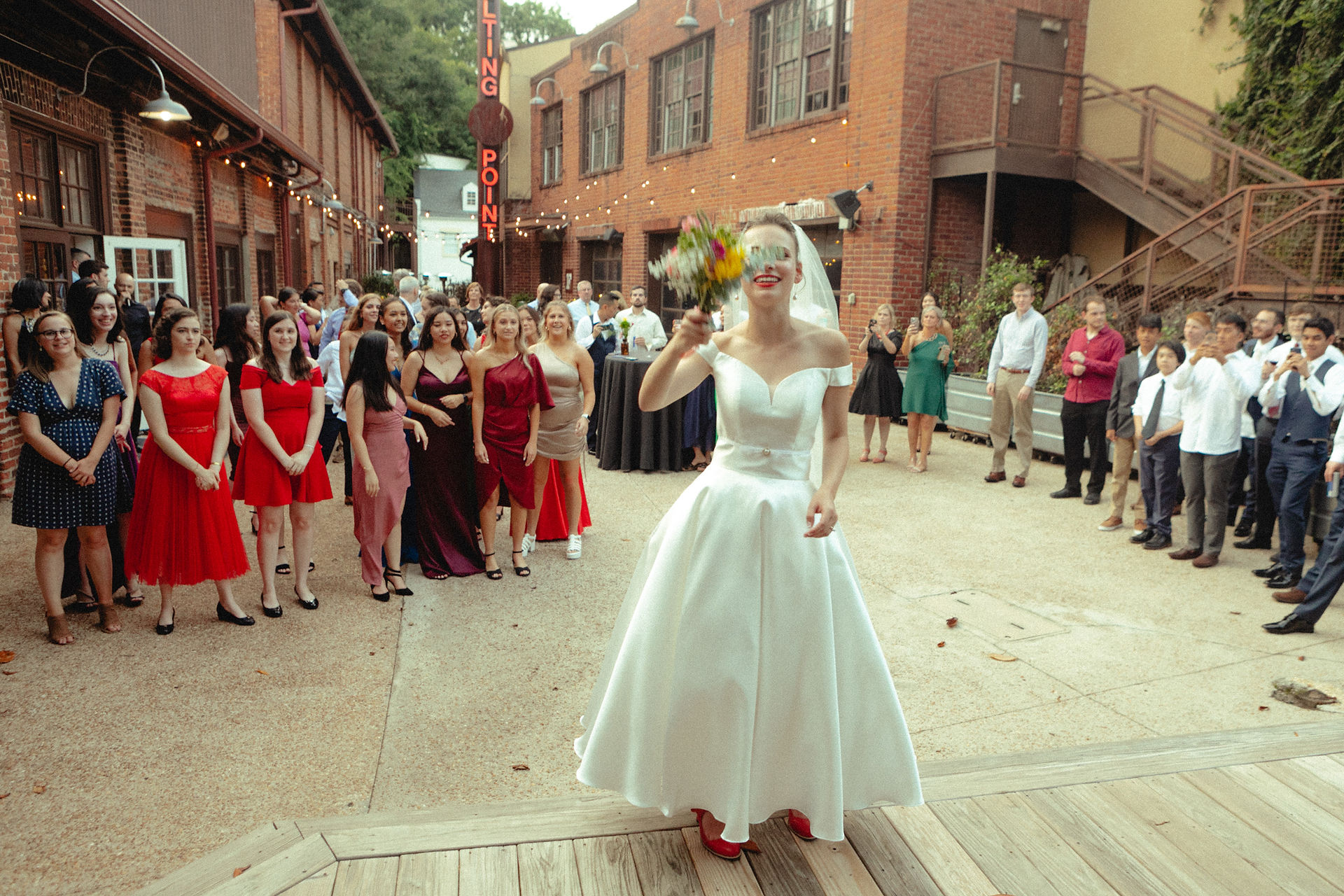 summer wedding photographer bouquet toss colorful timeless vintage film