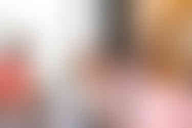 Women in a chair opening a gift with little girl at Buck Head, GA baby shower