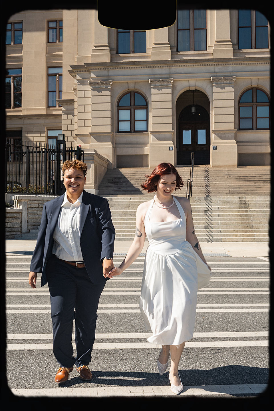 WLW engagement session, Georgia State Capitol, Atlanta, downtown Atlanta engagement session, same-sex couple, two brides, classic architecture, marble staircases, elegant setting, timeless aesthetic, soft natural light, editorial portraits, candid moments, romantic, playful connection, intimate moments, historic Atlanta location, refined backdrop, light-filled interior, outdoor steps, documentary-style photography