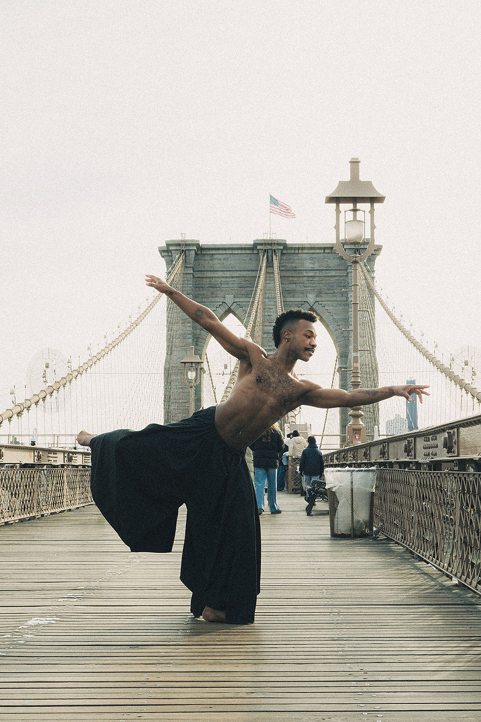 Alvin Ailey American Dance Theater inspired, contemporary dance, graceful male dancer, fluid motion, expressive storytelling, Horton Technique, dramatic stage lighting, golden hour glow, NYC rooftop, wind flowing fabric, emotional intensity, cinematic shadows, motion blur, artistic, 35mm film grain