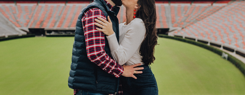 couple's engagement photography at dooley field in athens, ga