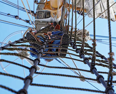 low-angle-view-sailor-climbing-up-mast.jpg
