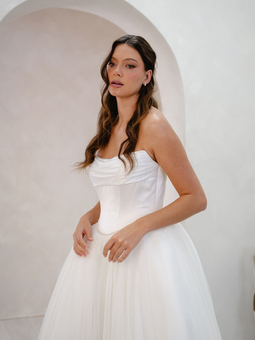 Two piece wedding dress, strapless fitted bodice with tulle ballgown skirt.
