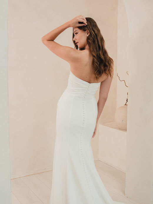 Strapless, fitted sweetheart neckline wedding dress with ruched detail and neckscarf. Available to Your Story Bridal, Marlow