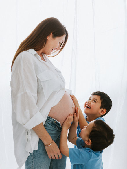 Relaxed maternity photography in Greenwich with mother and children at The Greenwich Studio