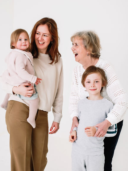 three generations family photography in white studio