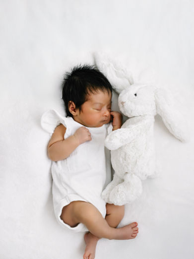 Newborn baby asleep with soft toy at The Greenwich Studio in SE London