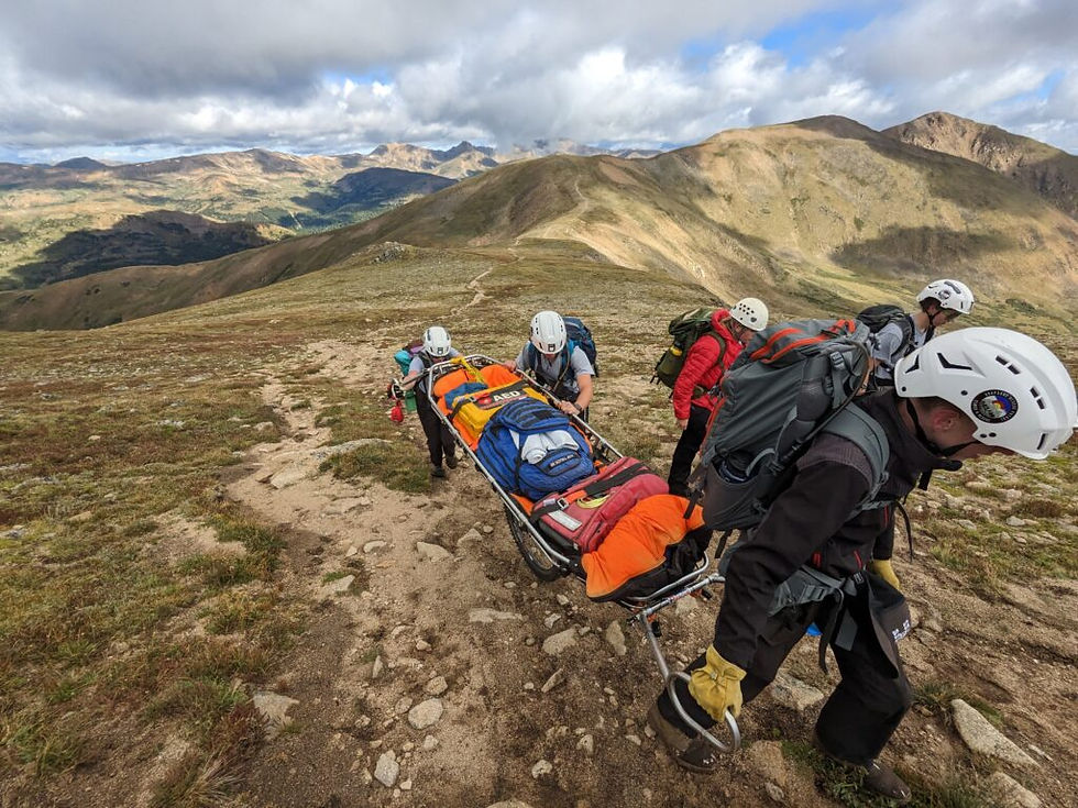 ARP Members on a training carrying a litter to the summit of a mountain