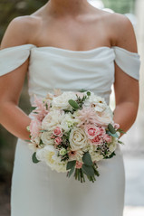 wedding at cathedral oaks detail photo of bride holding blush and cream wedding bouquet